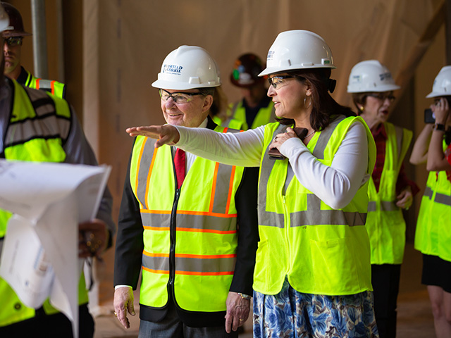 Dr. Mary Taylor, chair of pediatrics, shows Sanderson Farms CEO and board chairman Joe Sanderson some of the features of the new children’s hospital tower. Sanderson and his wife, Kathy, chair the Campaign for Children’s of Mississippi.